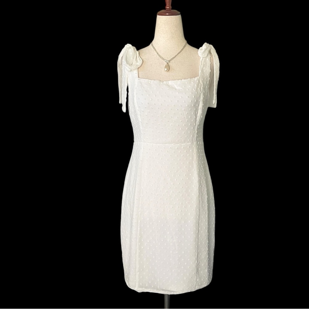 Lulus white dress with a Swiss dot pattern with adjustable tie shoulders